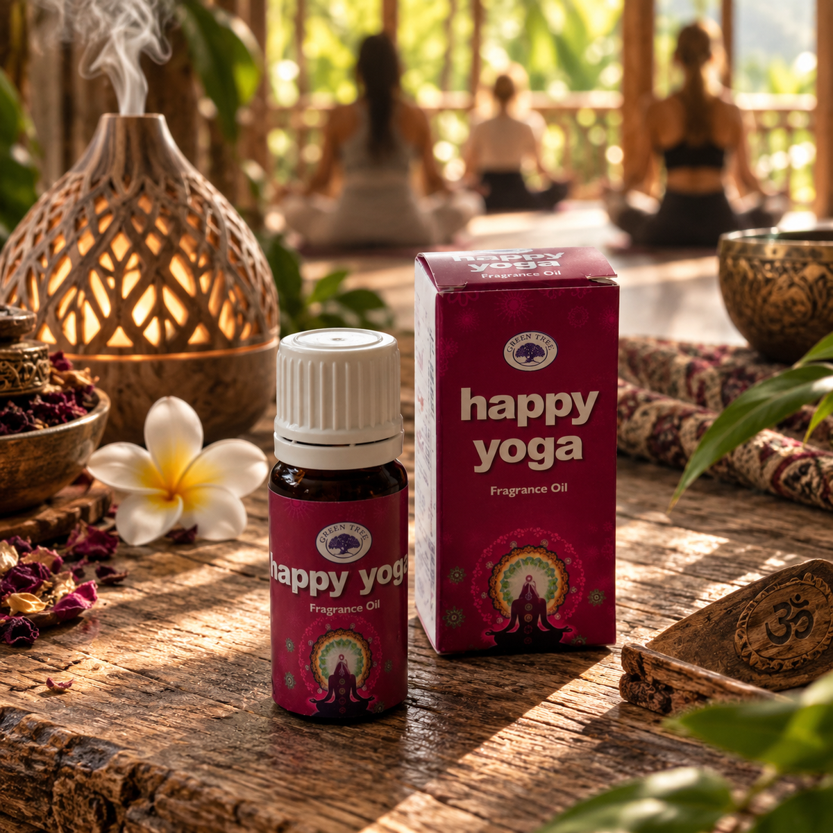 Green Tree Happy Yoga Fragrance Oil bottle and box beside an aroma diffuser in a yoga setting