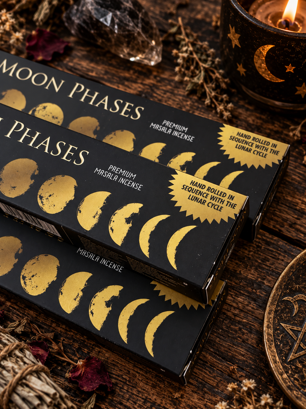 Green Tree Moon Phases premium masala incense boxes with gold lunar cycle design styled with a moon candle and crystals.