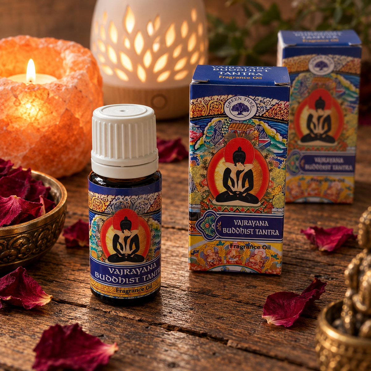 Green Tree Vajrayana Buddhist Tantra Fragrance Oil bottle and packaging styled beside candles and an aroma diffuser
