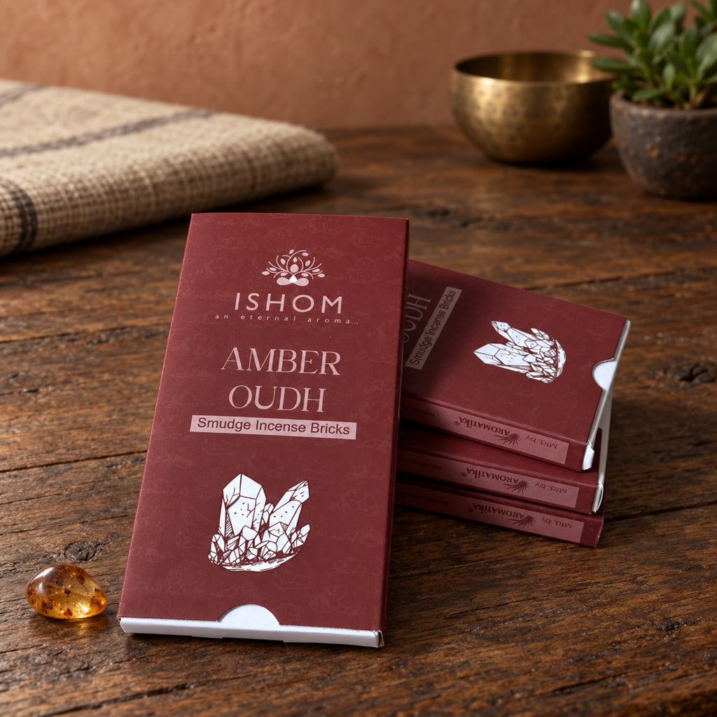 ISHOM Amber Oudh smudge incense bricks packaging on rustic wooden surface