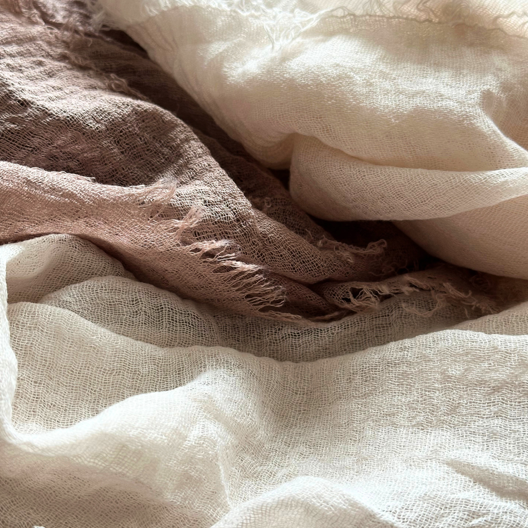 Close-up of lightweight Ivory and Cacao linen blend scarf fabric and textured weave.