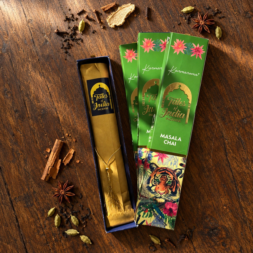 Open Tales of India Masala Chai incense package with wrapped incense bundle surrounded by cinnamon, cardamom and cloves.