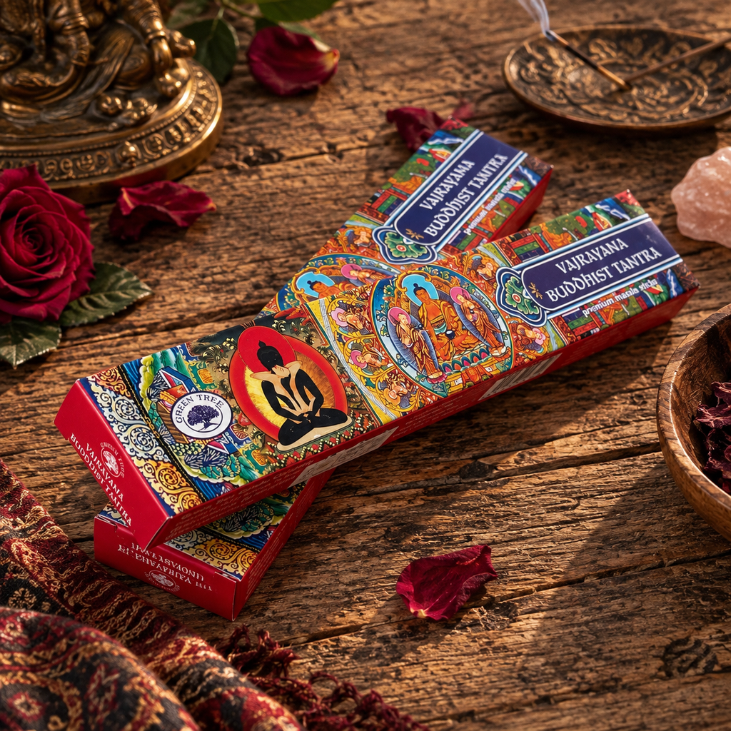 Two Green Tree Vajrayana Buddhist Tantra premium masala incense boxes displayed beside a burning incense stick and decorative accessories.